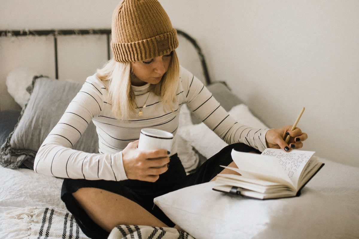 woman writing in journal